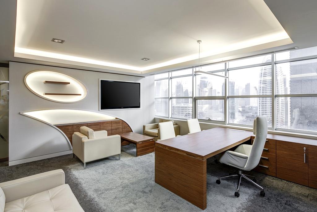 Modern ergonomic home office workspace with adjustable desk and ergonomic chair