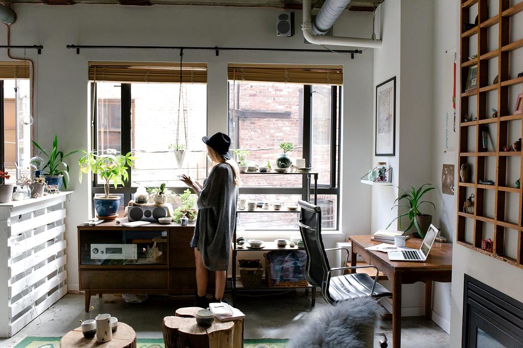 Person adjusting office chair in ergonomic home workspace